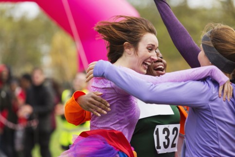 Three amateur athletes celebrating a race