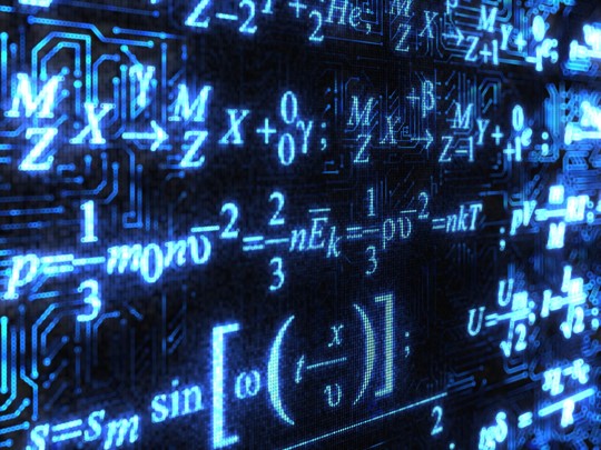 Mathematical equations (bright electronic blue lettering on a large screen)