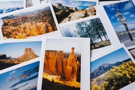 Variety of photographs scattered about showing gorgeous landscapes